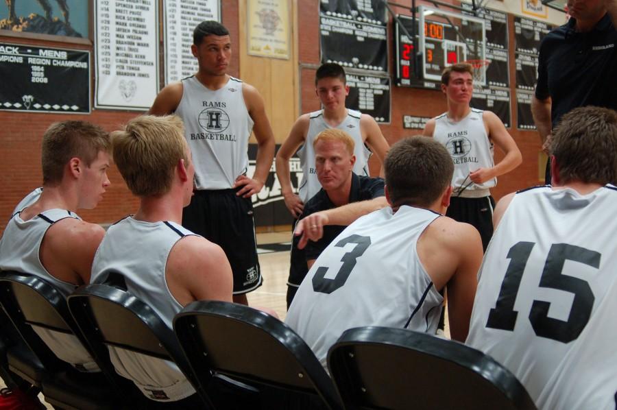 Coach+Boyce+talks+to+his+varsity+players+at+halftime