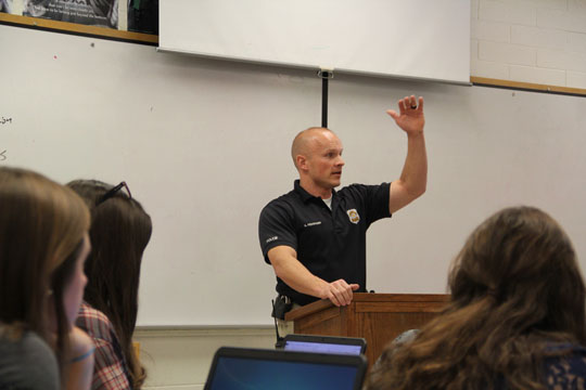 Officer Andrew Pedersen talks to students about police brutality