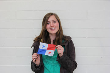 Kylie Pluim holds up the flag of Panama.