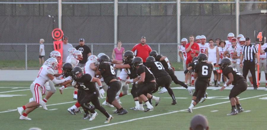 QB James Pembroke rolls out to pass against Bountiful