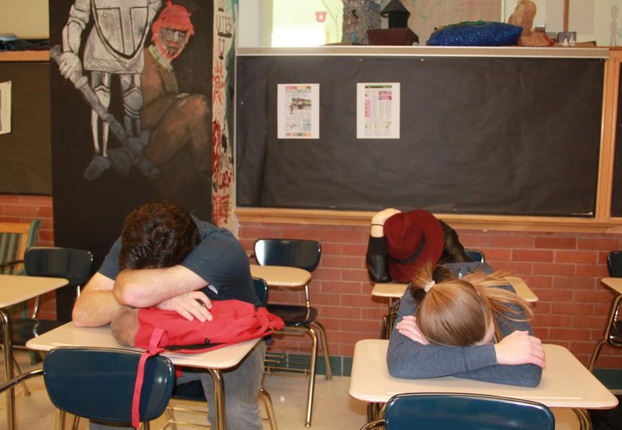 Students sleep during their first period class.