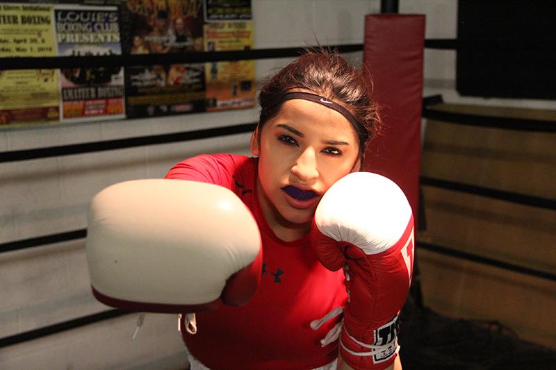 Michelle Maya throws a jab during a training session. The Highland junior is a champion boxer. 
