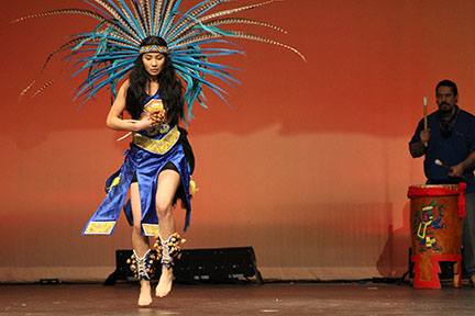 Jaira Amaya dances to the beat of the drum in Highlands Talents and Traditions assembly.