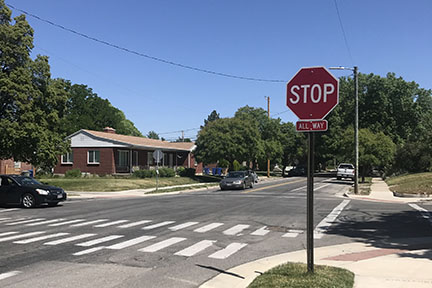 Cars stop at the new stop sign 