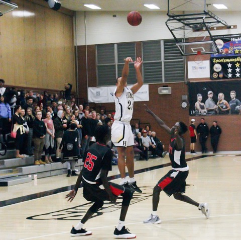 Senior Elijah Shelton shoots a 3-pointer against the West High Panthers. 