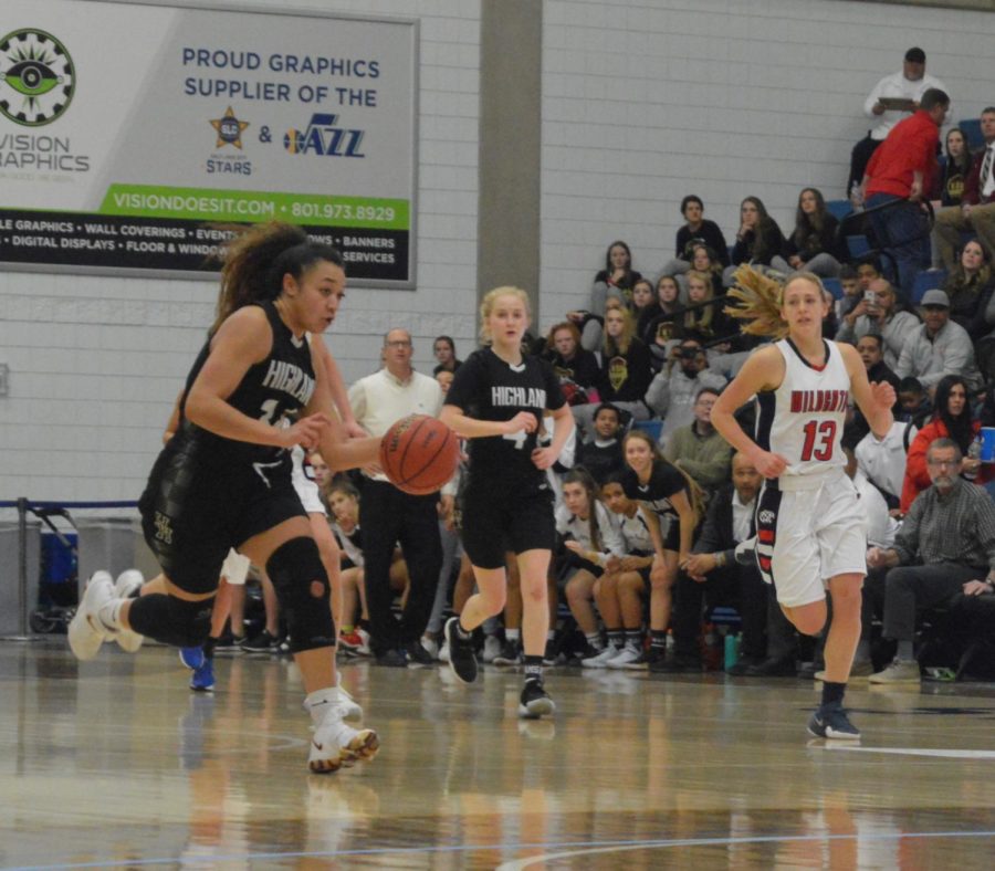 Senior Misini Fifita runs down the court in an attempt to score for Highland.