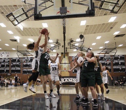 Senior Misini Fifita attempts to score against an Olympus player. 