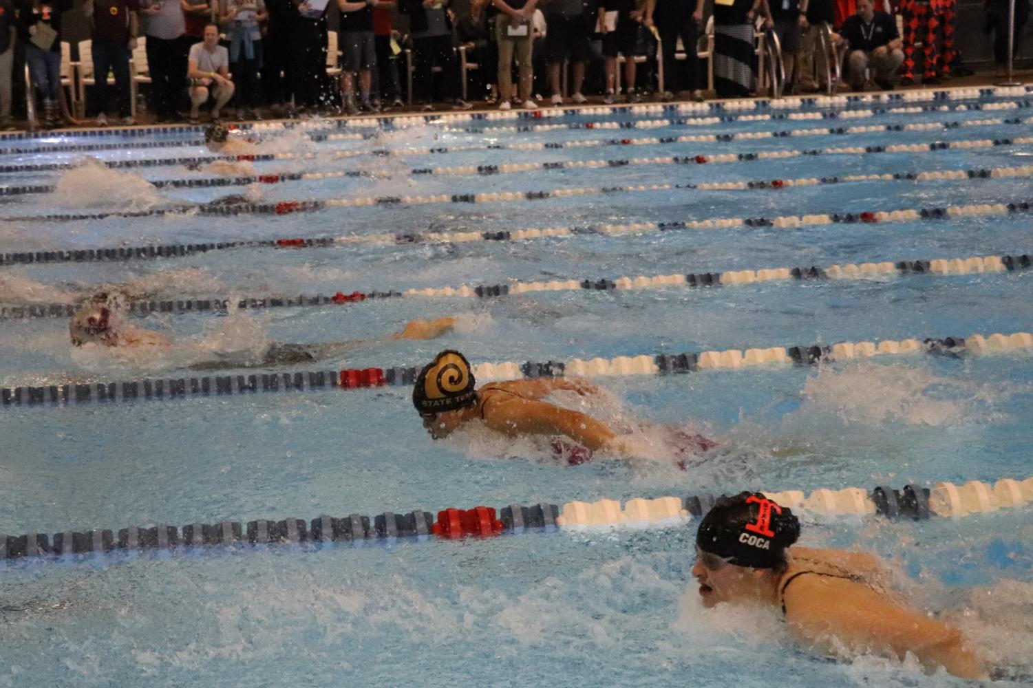 Highland swimmer Kara Ngu participates in the 100 meter butterfly race at Highland's state championship meet.