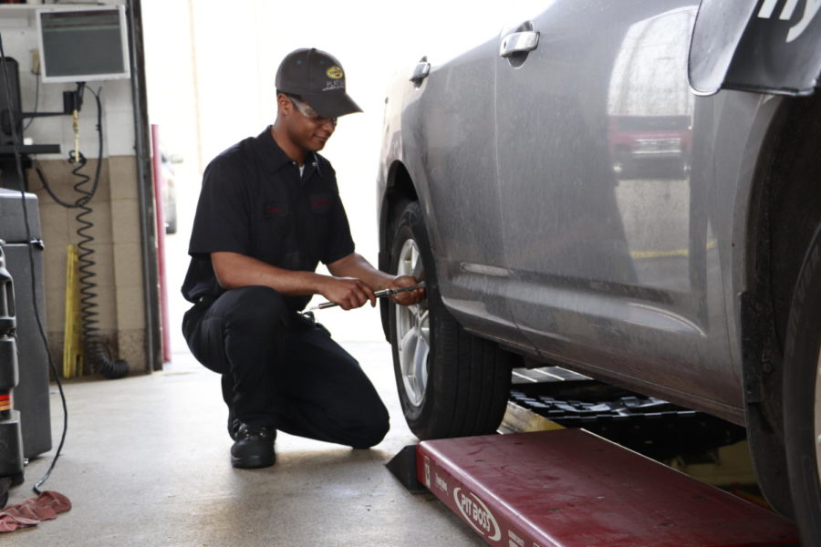 Diata Whitfield works on a car at Jiffy Lube 