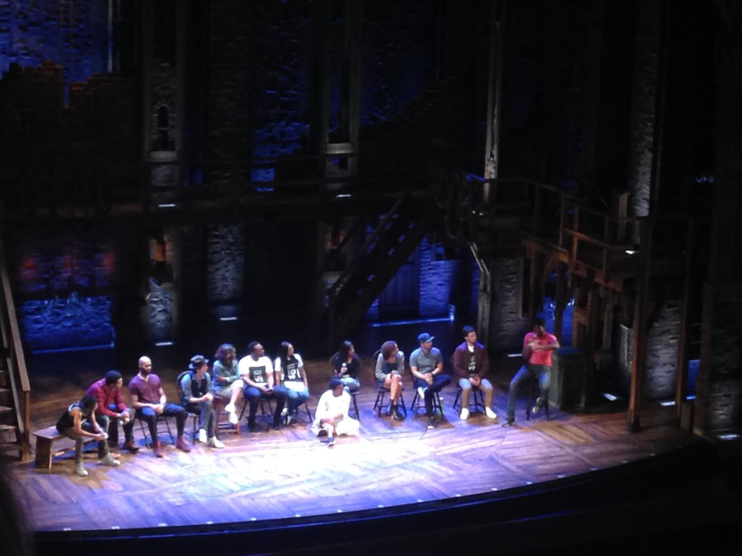 The cast of Hamilton answer students' questions during a part of a special field trip to see a matinee performance of the musical.