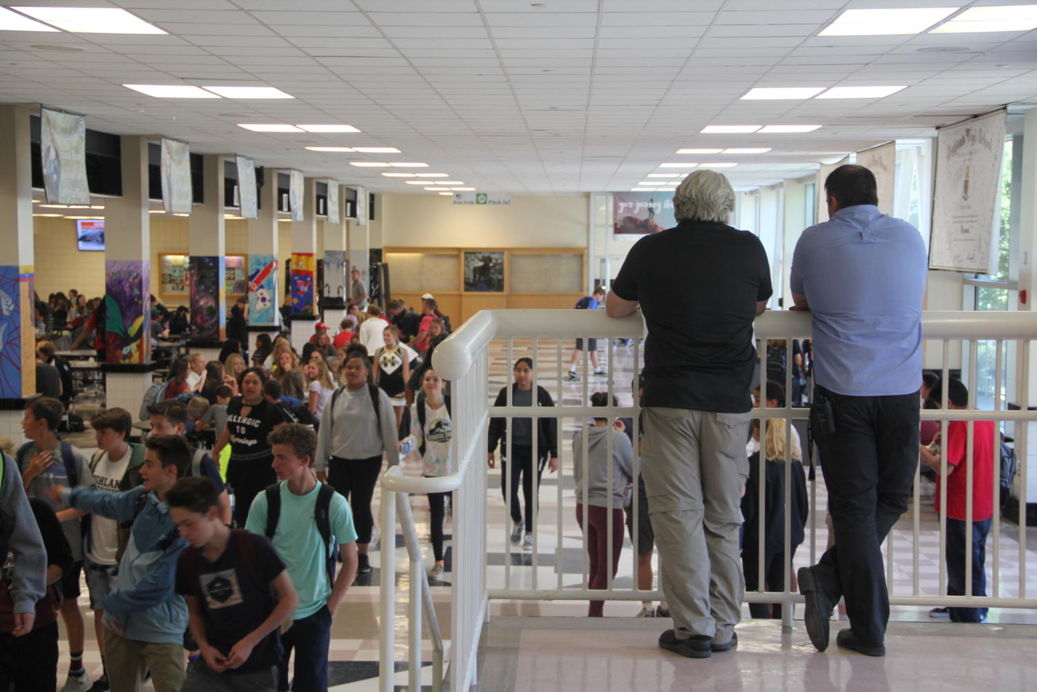 Principal Chris Jenson and vice principal Jon Jensen watch over the cafeteria during lunch.
