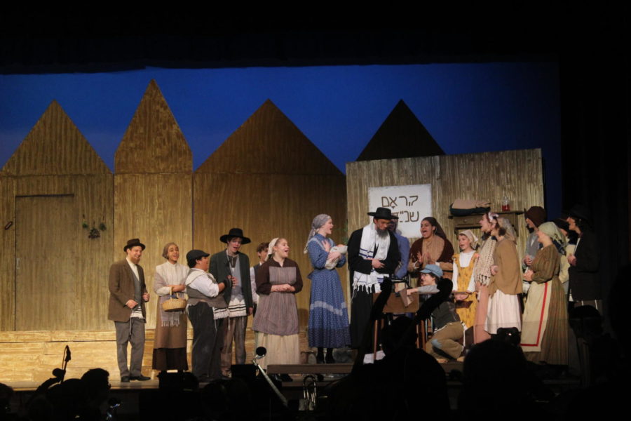 The cast of this years musical perform during Fiddler on the Roof. 