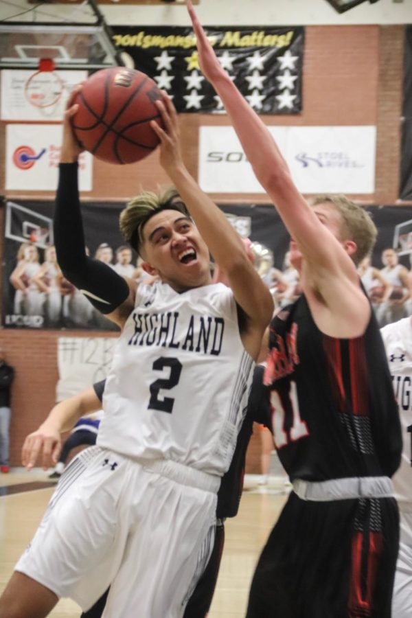 Highland Senior Liki Makaui goes up for a contested lay up against Murray. 