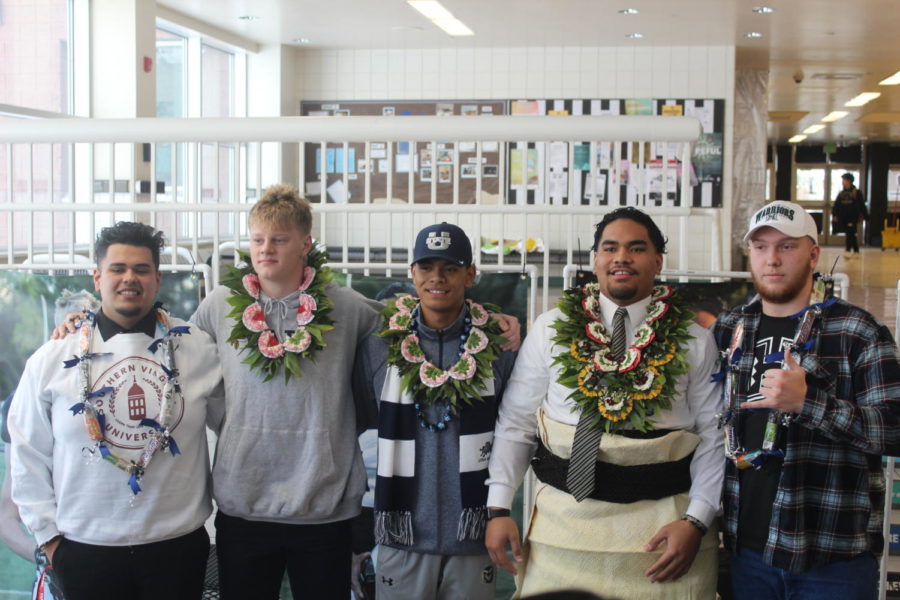 Athletes who signed (from left to right) Arturo Lagunas, Jackson Hawes, Bronson Olevao, Kaufusi Pakofe, and Caden Hilborn.