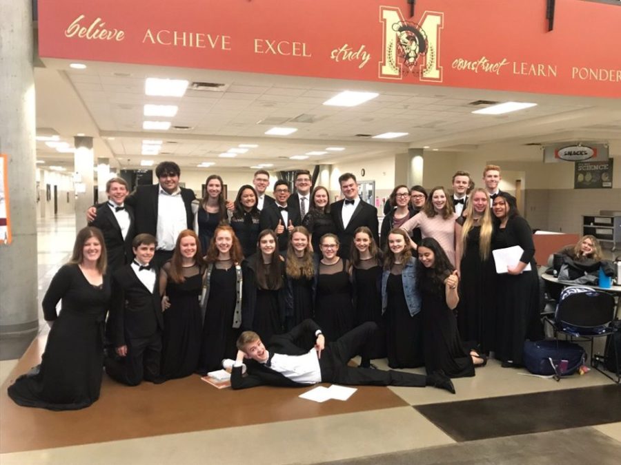 The+Madrigals+Choir%2C+along+with+director+Katie+Houston+-+kneeling+on+the+far+left%2C+pose+for+pictures+at+the+regions+competition.+