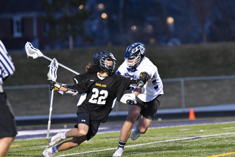 Senior attckmen Gage Varanakis dodges against a Corner Canyon defensemen last week.