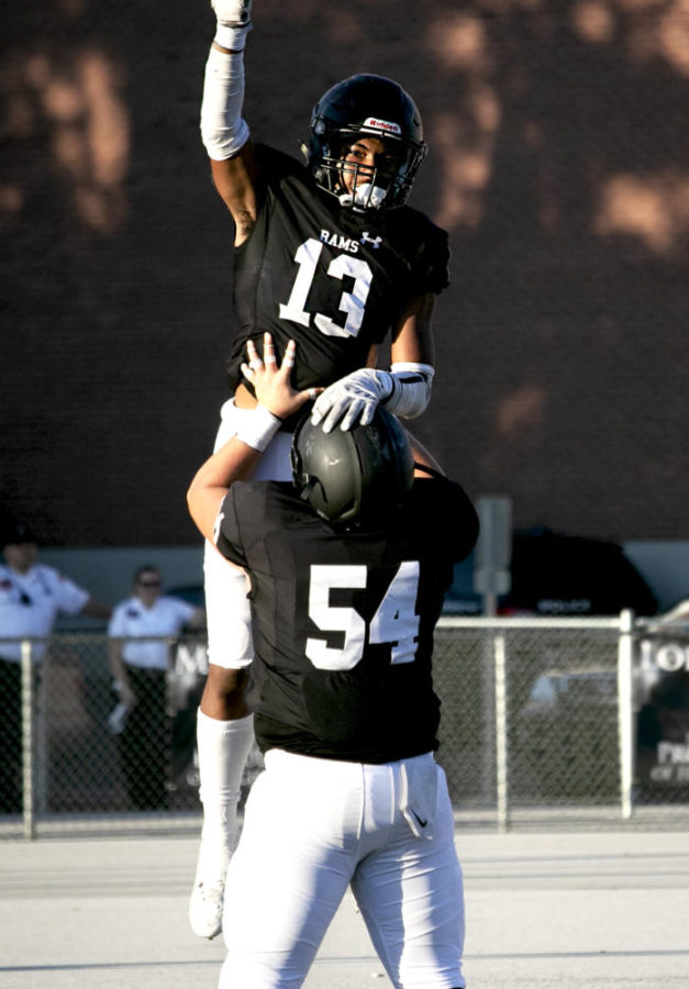 Ousmane Doumbia celebrates after a long run to a touchdown.