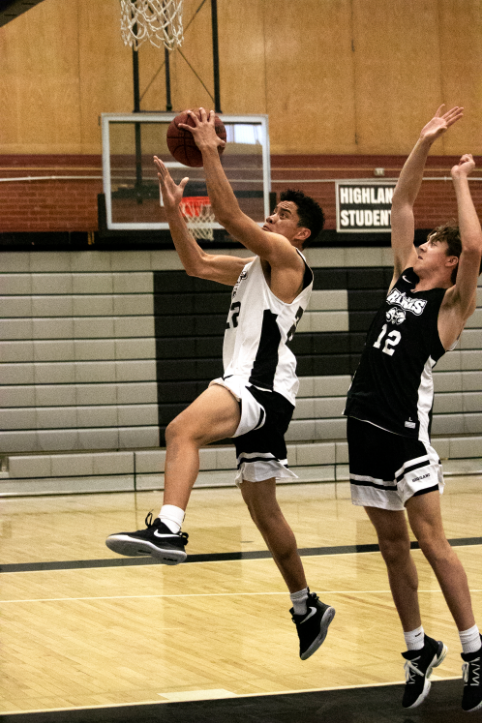 Sophomore Bronson Olevao elevates and looks to score during a practice.