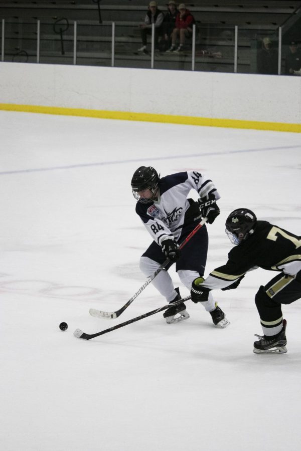 The Salt Lake Stars and NUI fighting for the puck during the Utah state championship game.