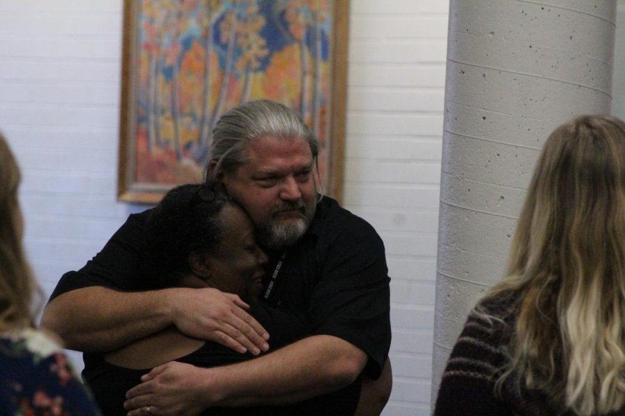 Chris Jenson hugs Rebecca Franco after announcing his departure plans.