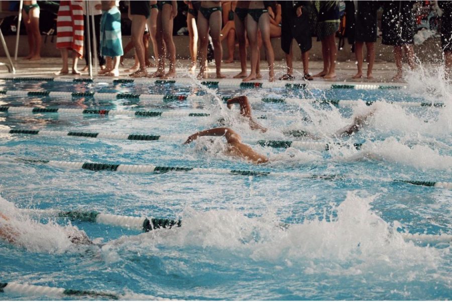 Highland swimmers race in a home meet last season. 