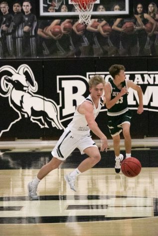 Highland player dribbles the ball across the court