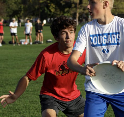 West High Schools Jonas Regehr blocks opponent during ultimate game at Riverside Park.