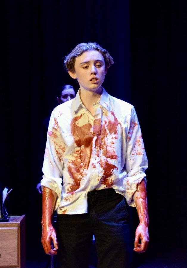 Sebastien Green wears a costume splattered with fake blood during his performance of Creon in Antigone.
