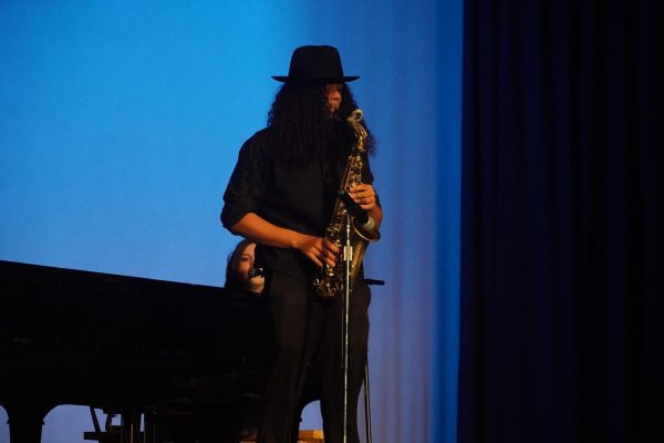 Leo Munoz Yarbrough plays the saxophone during the talent show