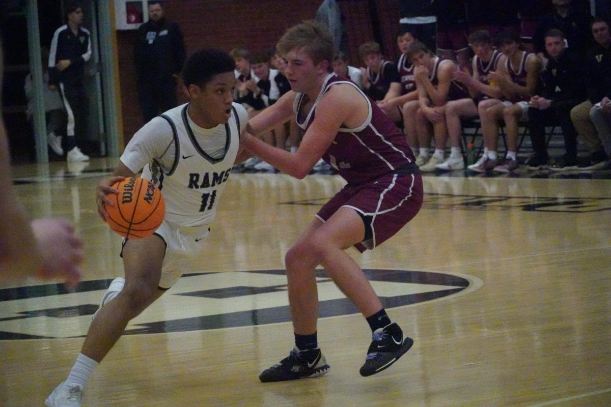 Isaiah Drisdom drives past a Viewmont player on February 21st in the first playoff game. 