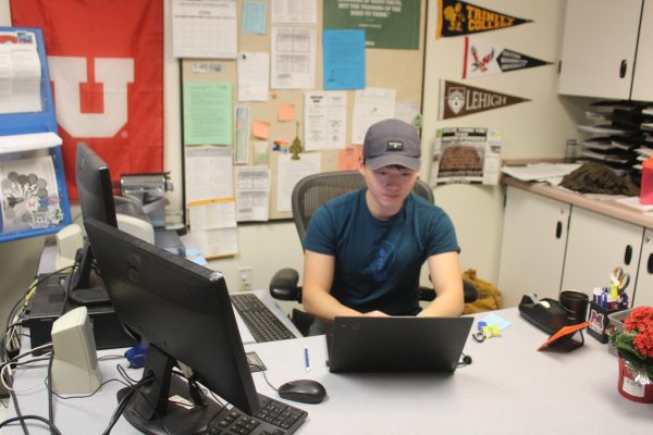 Highlands college advisor, Wes Lee, works at his computer.