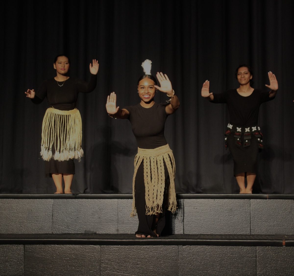 Madeleine Hosea (left), Lose Tenifa (middle), and Curly Taulanga (right) perform with the People of the Pacific in Highlands Multicultural Assembly.