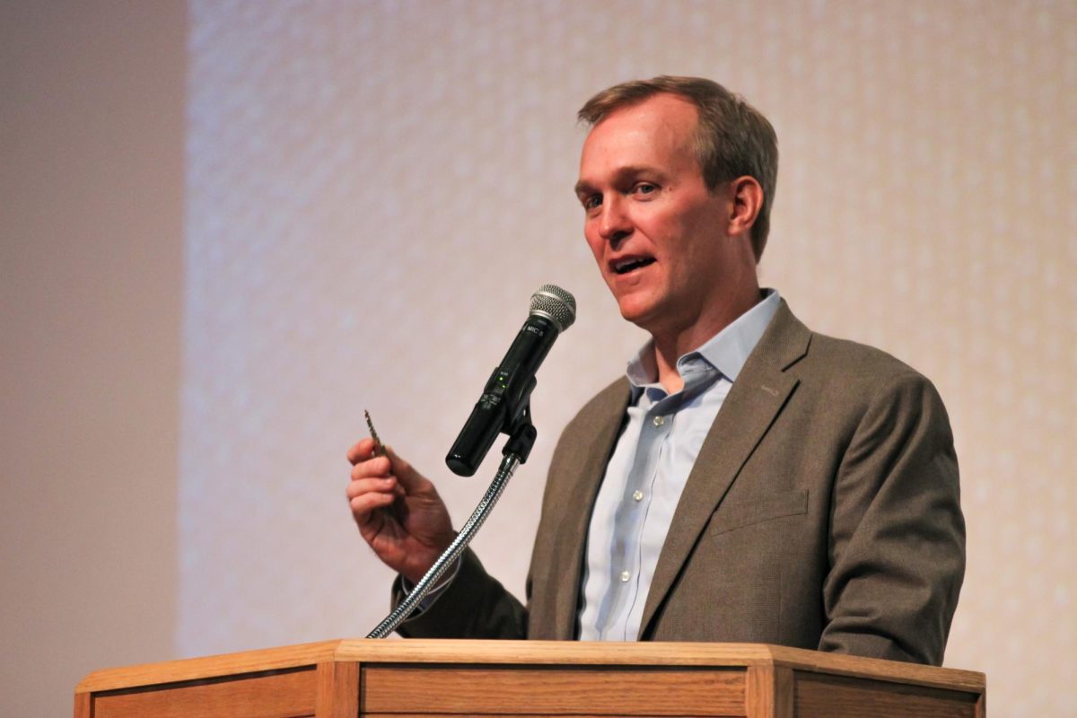 Ben McAdams holding the key to the mayor's office during his speech at Highland High. 