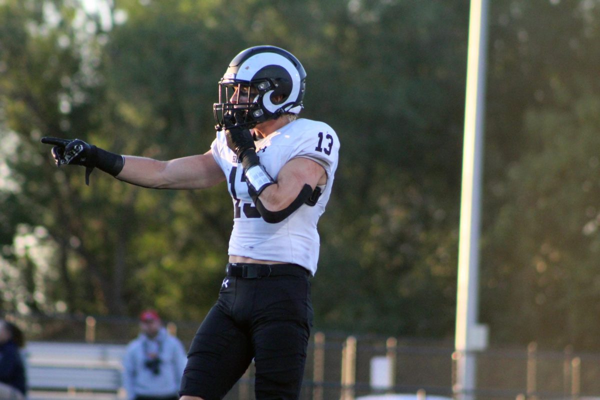 Charlie McConkie on defense against Skyline