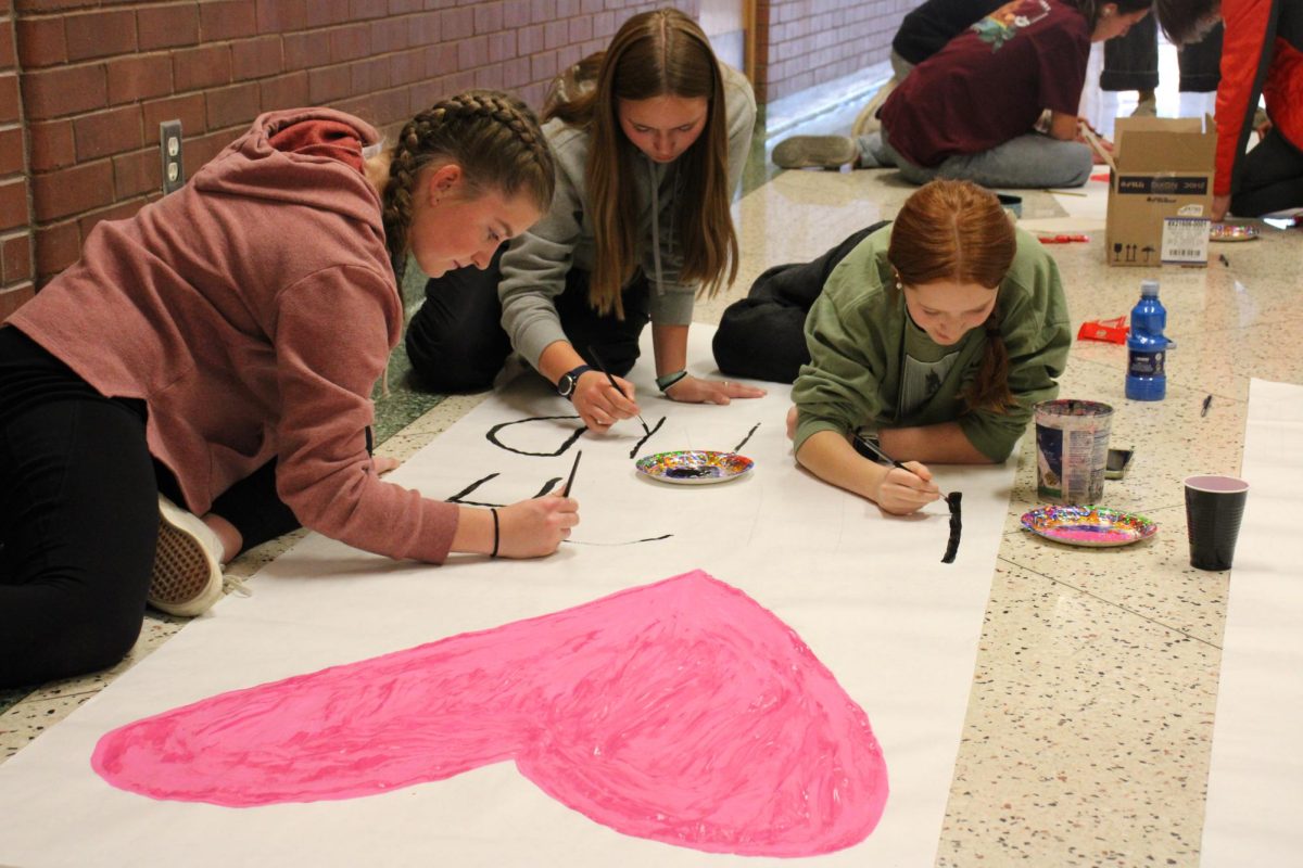 Highland students make posters for Mindy Smith to spread awareness on holiday needs. 