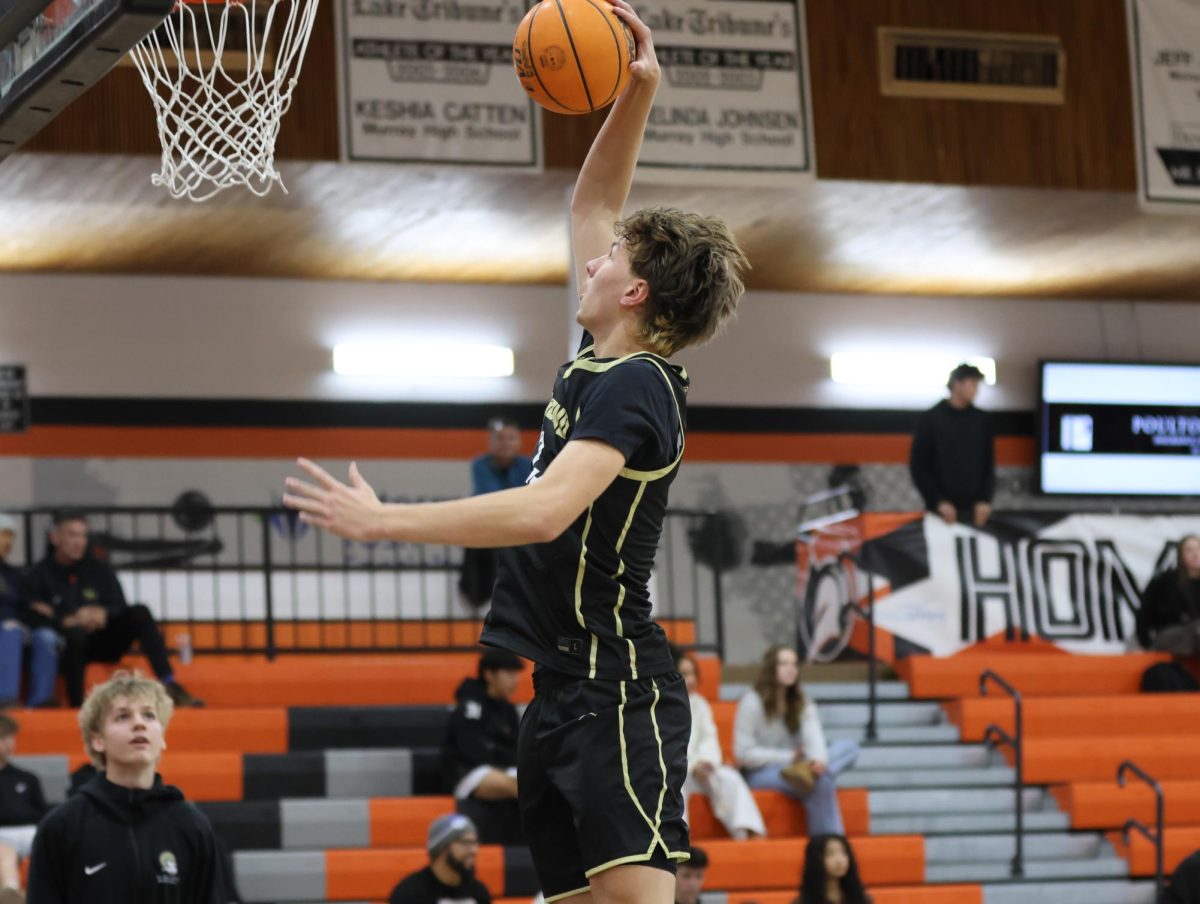 Junior Soren Ries throws down in warmups.