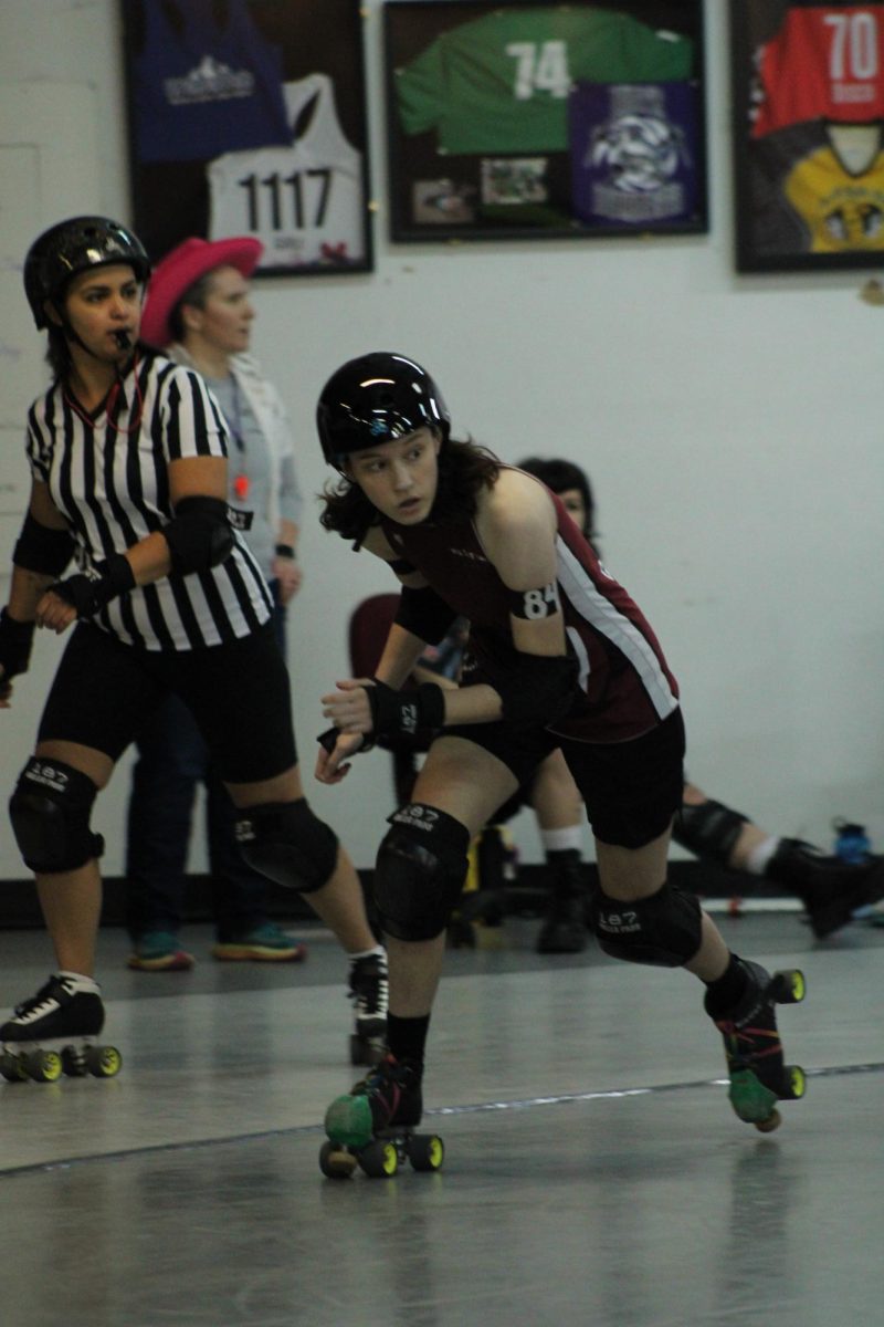 Highland student Blue Andres works their way around the track during a roller derby match on Saturday, Feb. 1.