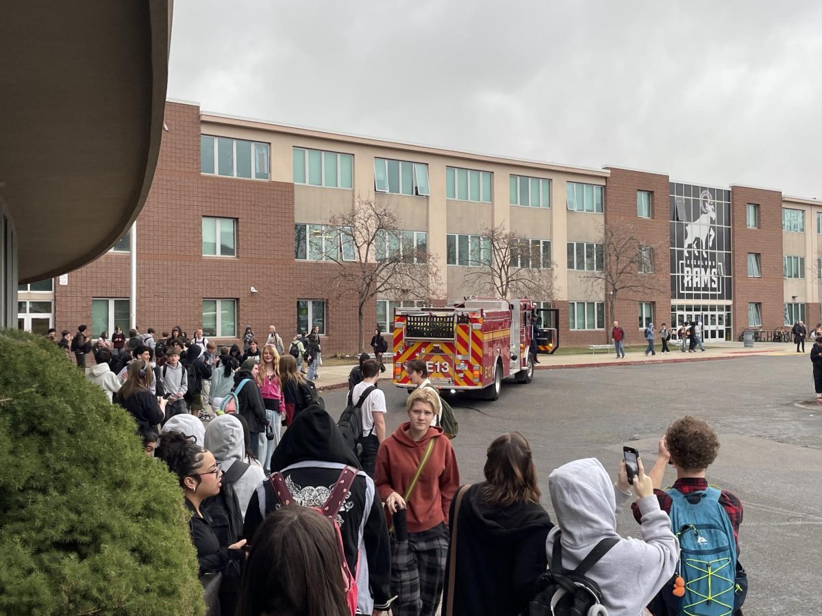 Students outside Highland as the fire department investigates a potential gas leak.