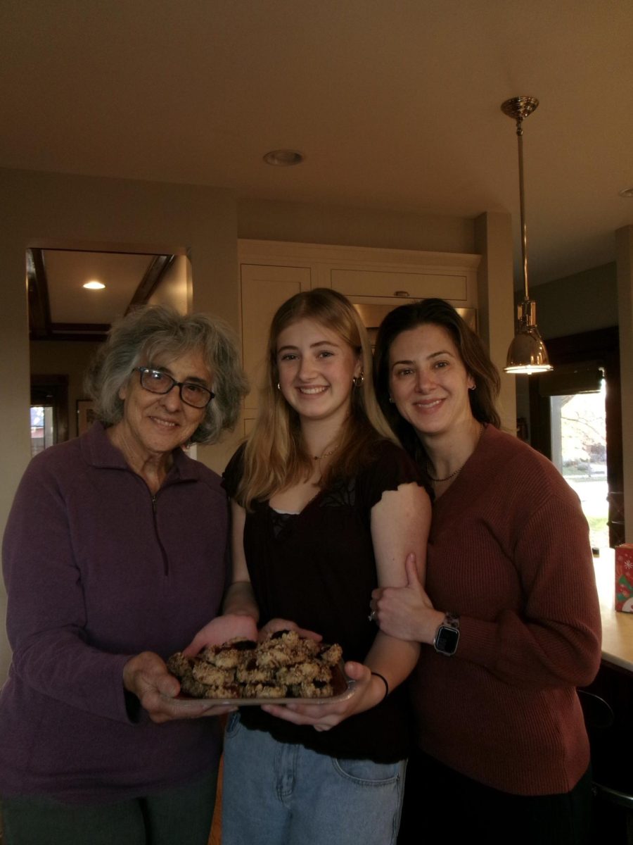 Marie Lindsey, Amalia Santos, and Heather Santos prepare thumbprint cookies every Christmas season