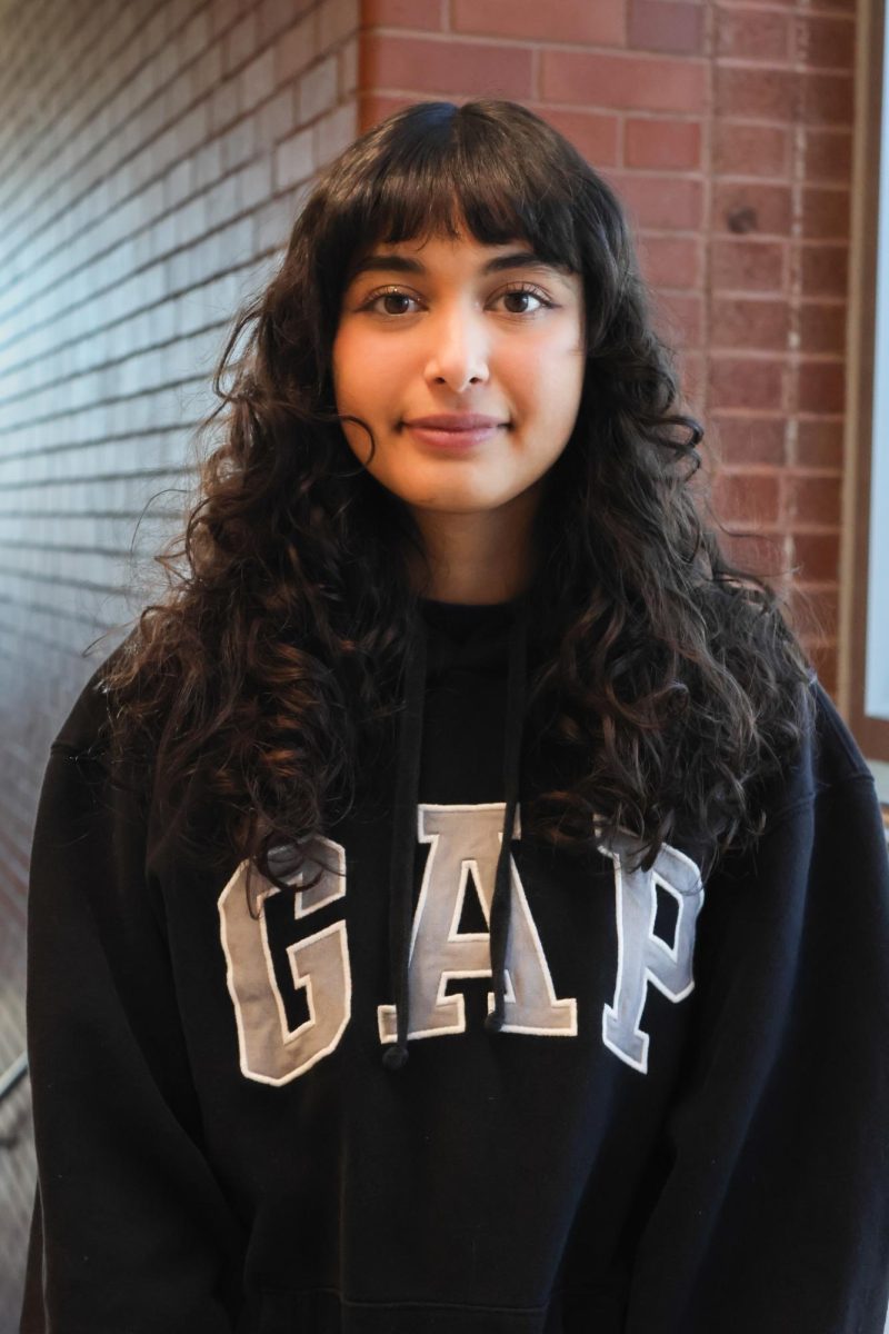 Dania Najam poses for picture in Highland hallway. 