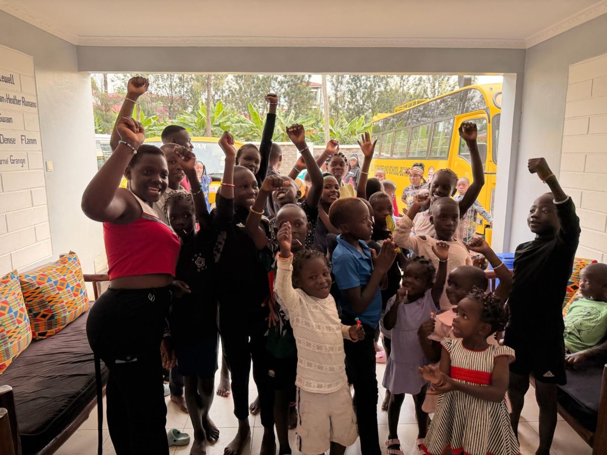 The children cheering for the team to arrive in their new school in Kakamega. 
