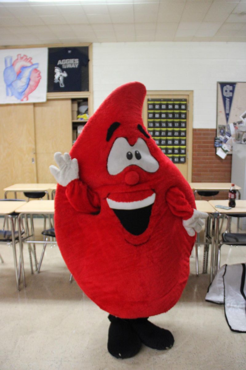 Student Stella Martin poses in blood costume after circling the school advertising HOSA's upcoming blood drive. 